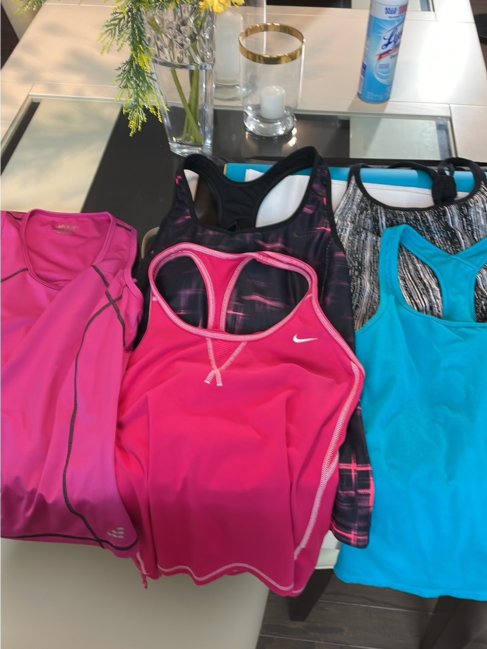 Nike and other name brands of Women’s Athletic Tank Tops. 5 count total